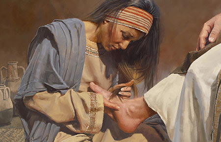 Washing Jesus' feet with her tears